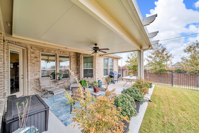 view of patio / terrace with a grill and ceiling fan