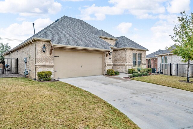 french country inspired facade featuring a front yard and central AC