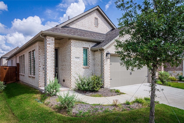 french provincial home featuring a garage