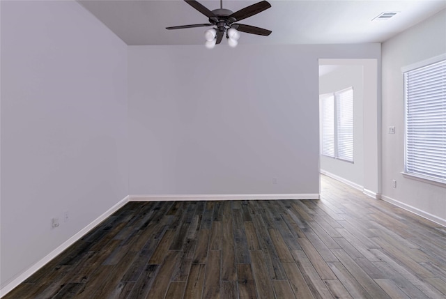 spare room with ceiling fan and dark hardwood / wood-style floors