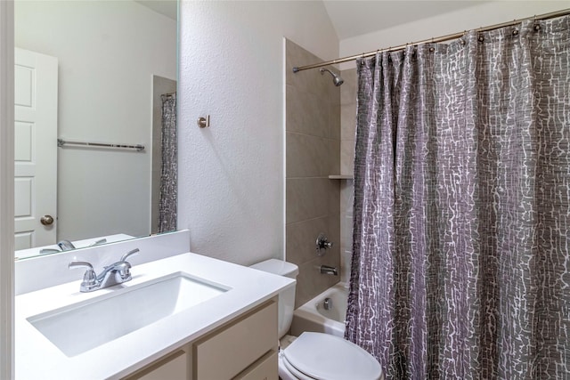 full bathroom with vanity, shower / bath combination with curtain, and toilet