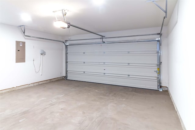 garage with electric panel and a garage door opener