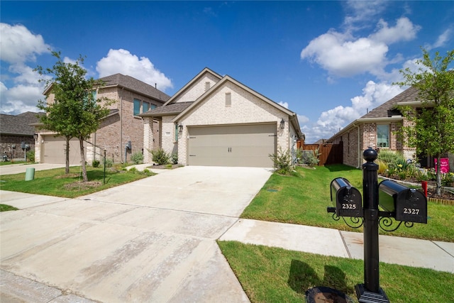 view of front of property featuring a garage and a front lawn