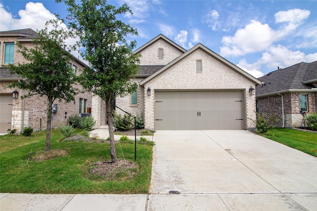 view of front of house with a front lawn and a garage