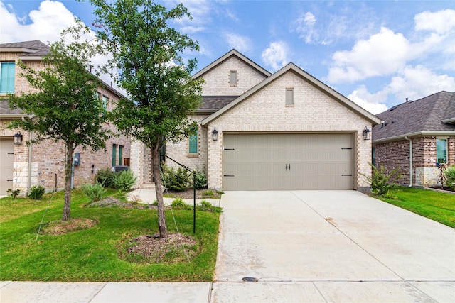 view of front facade with a garage and a front yard