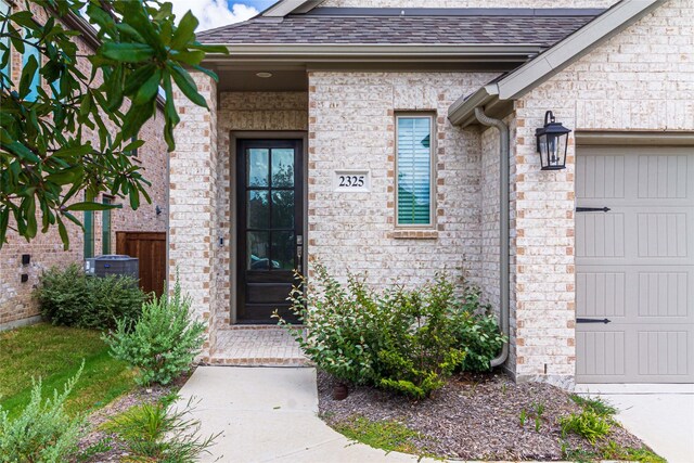 property entrance with a garage