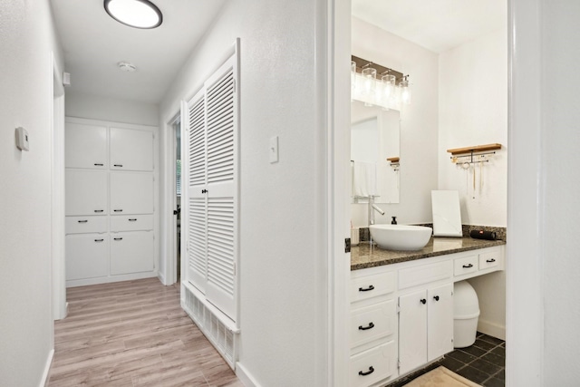 bathroom featuring vanity and hardwood / wood-style floors