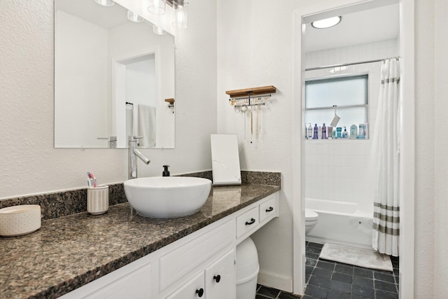 full bathroom featuring tile patterned floors, vanity, toilet, and shower / bath combo with shower curtain