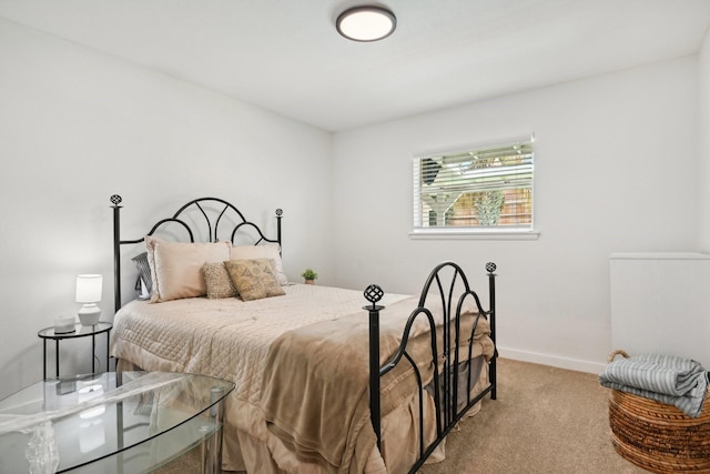 bedroom with light colored carpet