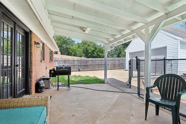 view of patio / terrace featuring a grill and french doors