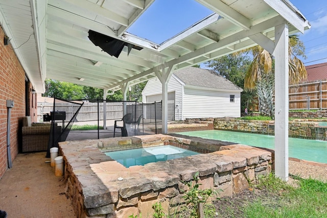 view of patio / terrace featuring an in ground hot tub