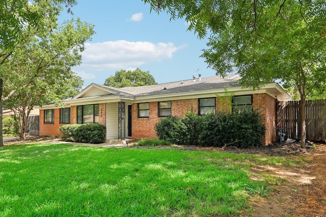 ranch-style home with a front yard