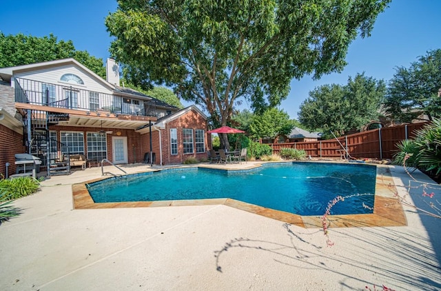 view of swimming pool with a fenced in pool, a fenced backyard, and a patio area