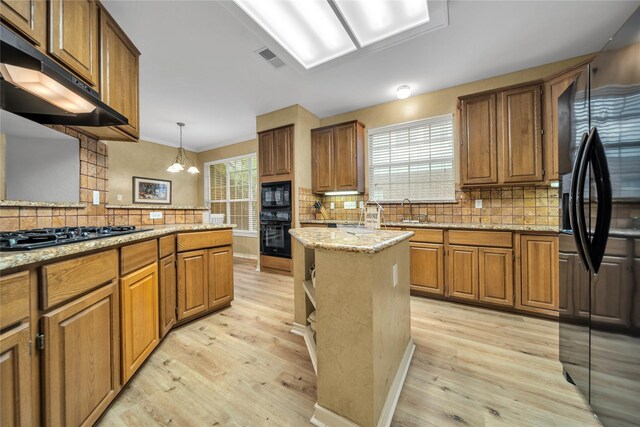 dining space featuring hardwood / wood-style flooring, plenty of natural light, crown molding, and a notable chandelier