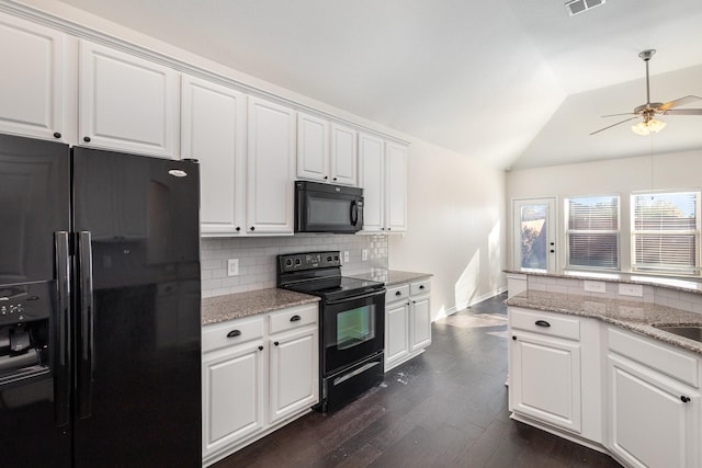 kitchen with black appliances, dark hardwood / wood-style flooring, white cabinets, and lofted ceiling