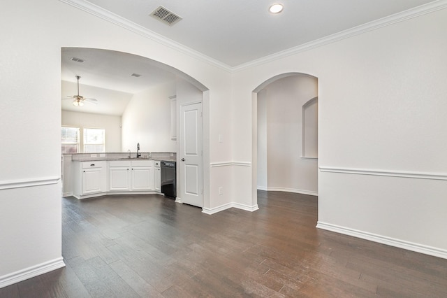 unfurnished room featuring ceiling fan, sink, dark hardwood / wood-style floors, crown molding, and lofted ceiling