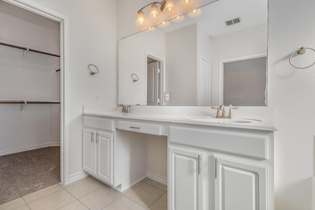 bathroom with tile patterned flooring and vanity