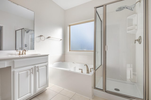 bathroom featuring tile patterned floors, vanity, and shower with separate bathtub