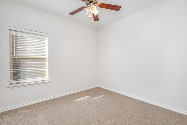 spare room with carpet floors and ceiling fan