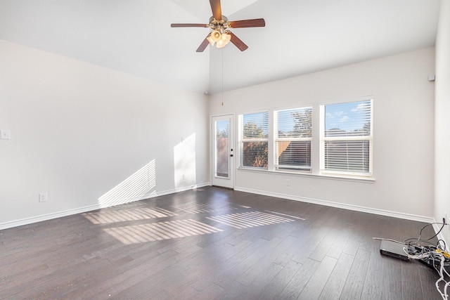 spare room with ceiling fan and dark hardwood / wood-style floors