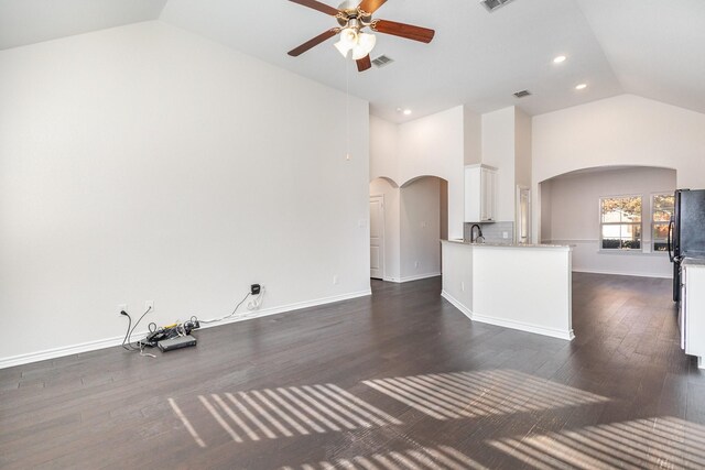 unfurnished living room with ceiling fan, high vaulted ceiling, dark hardwood / wood-style floors, and sink