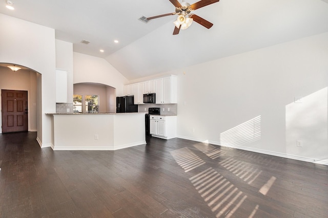 living room featuring dark hardwood / wood-style floors, high vaulted ceiling, and ceiling fan