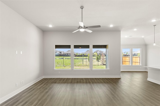 unfurnished living room with dark wood-style flooring, recessed lighting, a ceiling fan, and baseboards