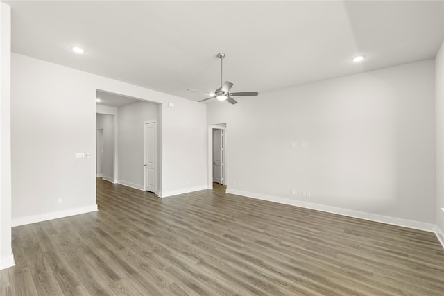 unfurnished living room featuring recessed lighting, ceiling fan, wood finished floors, and baseboards