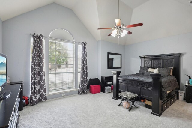 carpeted bedroom with vaulted ceiling and ceiling fan