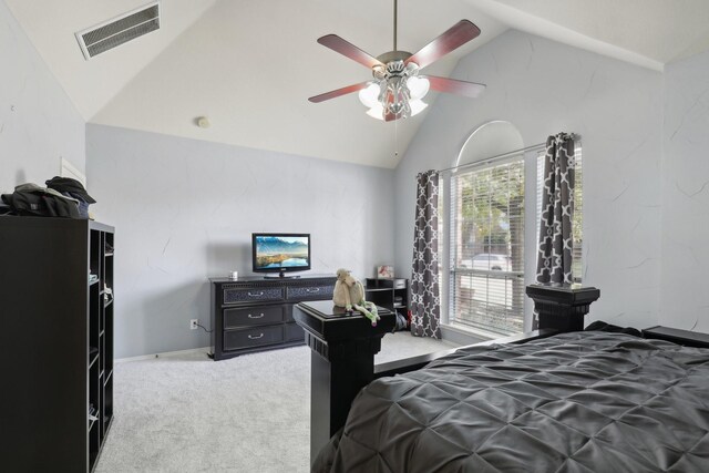 carpeted bedroom featuring ceiling fan and high vaulted ceiling