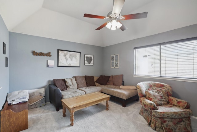 carpeted living room featuring ceiling fan and lofted ceiling