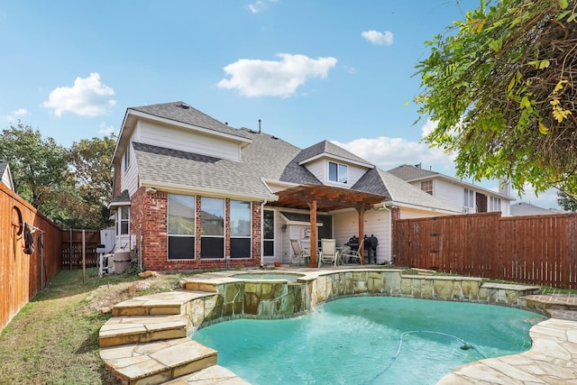 view of swimming pool featuring a pergola and an in ground hot tub