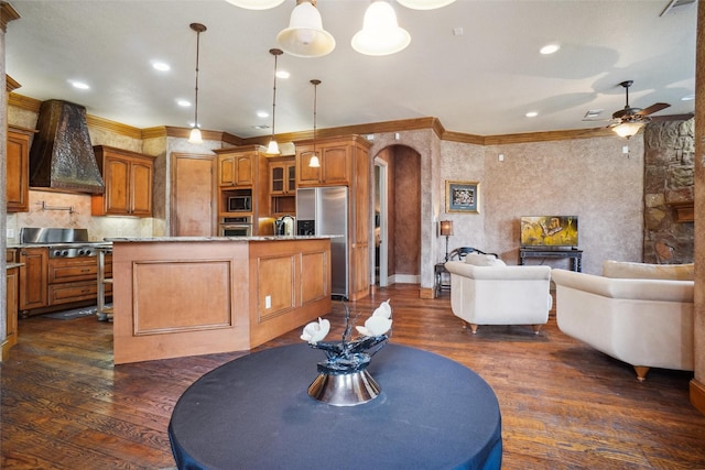 dining room featuring crown molding, sink, ceiling fan, and dark hardwood / wood-style flooring