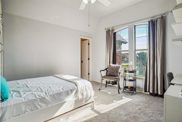 bedroom with vaulted ceiling, light carpet, and ceiling fan