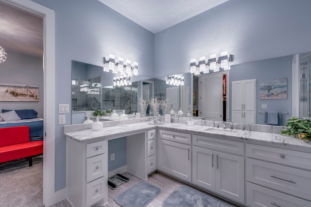 bathroom featuring vanity and a shower