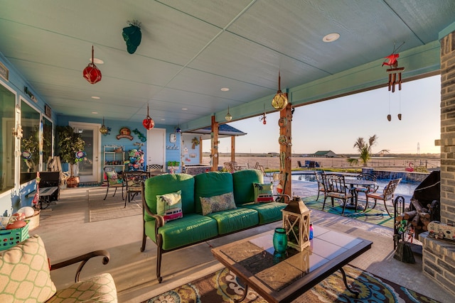 patio terrace at dusk featuring outdoor lounge area