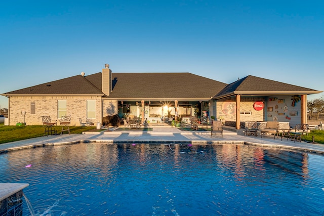 view of pool featuring a patio area