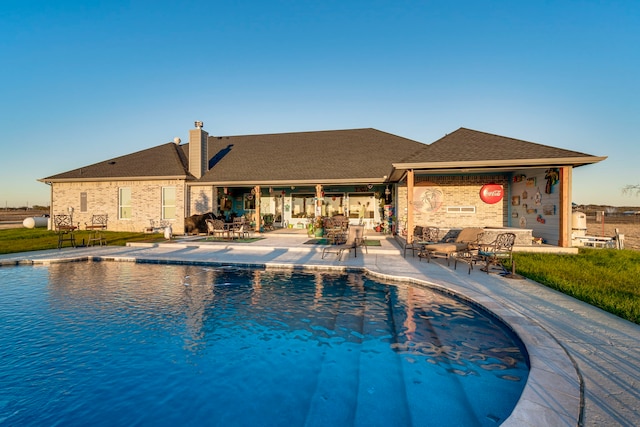 view of pool featuring a patio area