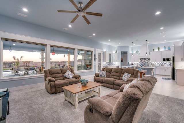 living room featuring ceiling fan