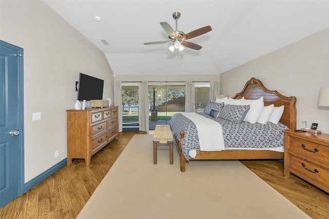 bedroom with vaulted ceiling, ceiling fan, and light wood-type flooring