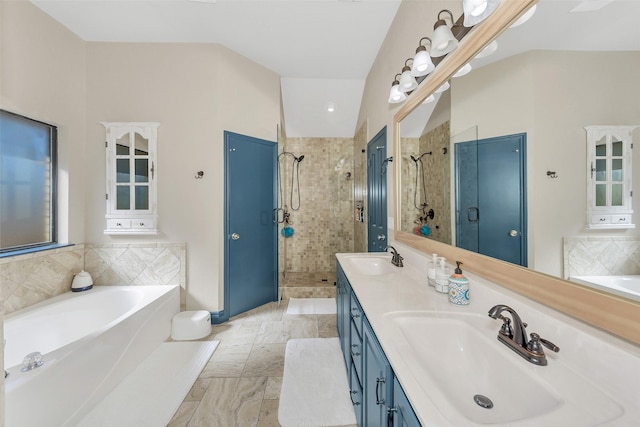 bathroom featuring vanity and separate shower and tub