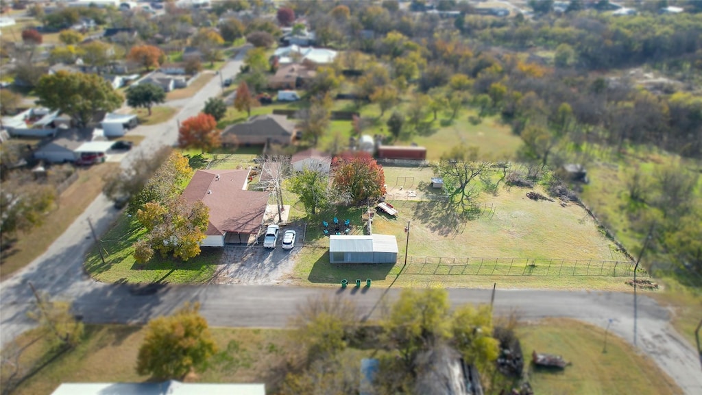 birds eye view of property with a rural view