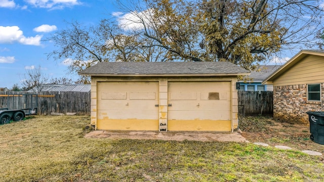 garage featuring a yard