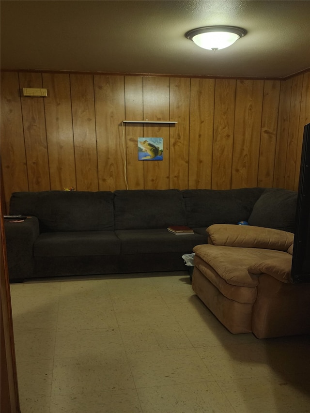 living room featuring wood walls