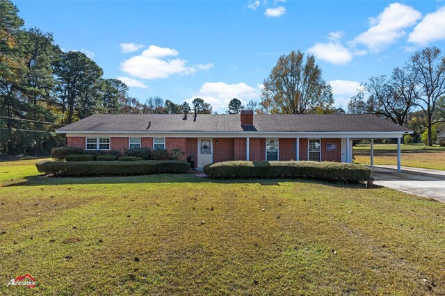 single story home with a front lawn and a carport