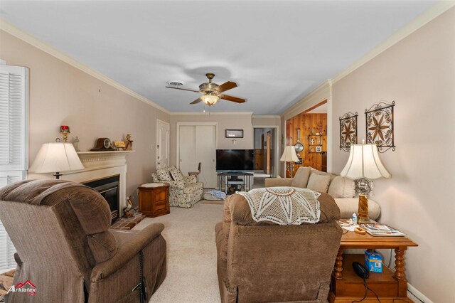 living room with crown molding, light colored carpet, and ceiling fan