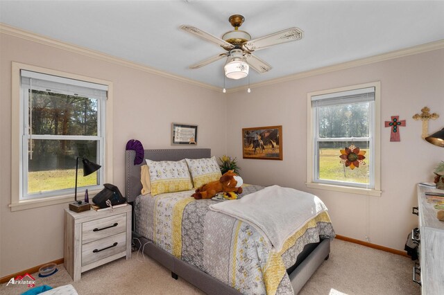 bedroom with multiple windows, crown molding, and light colored carpet