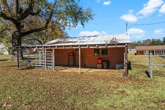 rear view of house with an outbuilding