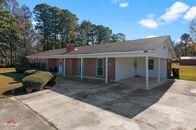 ranch-style home with a carport