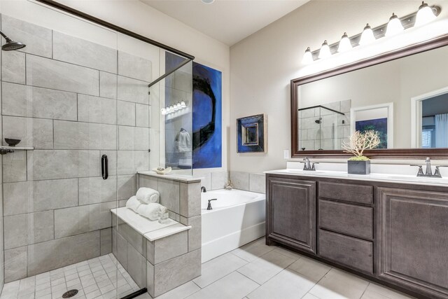 bathroom featuring vanity, separate shower and tub, and tile patterned floors